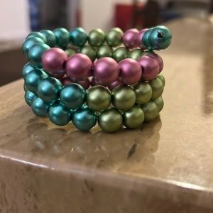 A pink, blue and green wrap bracelet